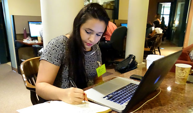Rule of Law intern with notepad and laptop